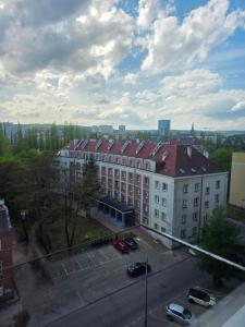a view of a large building with a parking lot at Siódme niebo in Gdańsk