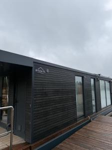 a building with a sign on it on a deck at Water House in Puck