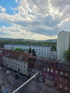 a view of a city with buildings and a cloudy sky at Siódme niebo in Gdańsk +1 photo