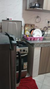 a kitchen with a stove and a plate on the counter at One Bedroom Roysambu Mirema Drive in Nairobi