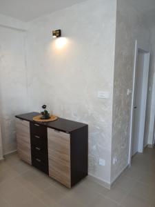a room with a desk with a light on the wall at Vendetta Montenegro in Risan