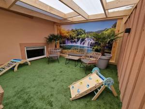 a play room with a mural of a waterfall at Fewo's kleine Auszeit in Quedlinburg