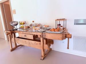 a table with some food on top of it at Agriturismo Rive De Guia in Valdobbiadene
