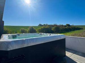 a bath tub sitting on the side of a wall at M&D Appartments in Valtice