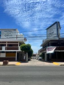 a street with a hotel on the side of a building at Hotel California in Mazatlán +13 photos