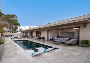 a house with a swimming pool in the yard at אלאיה סוויטות יוקרה in Shomera