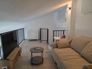 a living room with a couch and a table at Summer house Le Vito in Tribunj