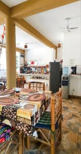 a kitchen with a table and chairs in a room at Casa Mazunte Tierra Viva in Mazunte