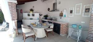 a kitchen with a table and chairs in a kitchen at Casa Providenca in Kaštelir