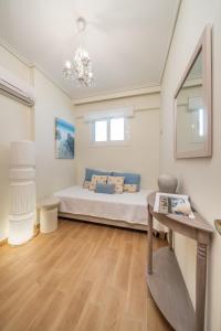 a bedroom with a bed in a room at Aura Seaside Apartment in Karavomylos