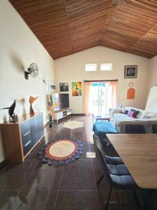 a living room with a couch and a table at Villa Prisca in Sainte Marie