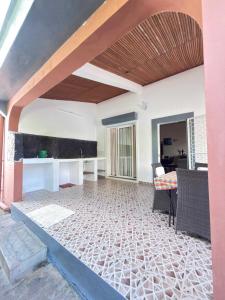 a living room with a couch and a table at Villa Prisca in Sainte Marie