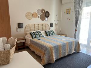 a bedroom with a bed and a chair at Bed and Breakfast Villa Giovanna in Rimini
