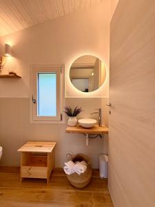 a bathroom with a sink and a mirror at Casetta a Lago in Onno