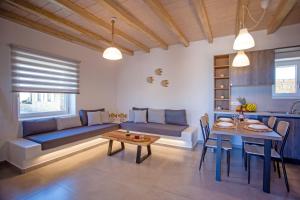 a living room with a couch and a table at Mystic Harmony in Mikonos