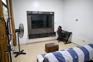 a living room with a flat screen tv at Depa en Pto Maldonado in Puerto Maldonado