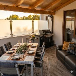a living room with a table and a couch at Luxury Histria Apartment with Private Pool Near the Beach in Banjole