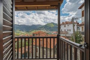 a balcony with a view of the mountains at Metsovo Fireplace Retreat 2 in Metsovo