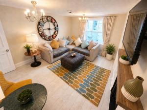 a living room with a couch and a table at Hexham Town Centre, Market Place View in Hexham