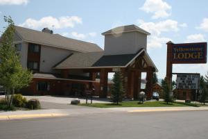 a lodge with a sign in front of it at Yellowstone Lodge in West Yellowstone