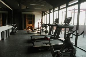 a gym with several exercise bikes and a laptop at Luxury Skyline Apartment with pool, city views & volcano views in El Rodeo