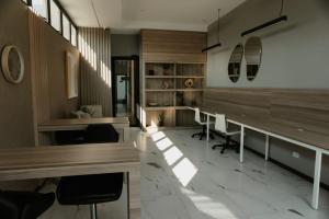 a office with desks and chairs in a room at Luxury Skyline Apartment with pool, city views & volcano views in El Rodeo +17 photos