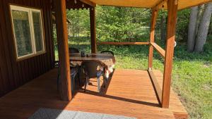 a porch with a table and chairs on a house at Siedlisko Silna Nowa in Silna Nowa +7 photos