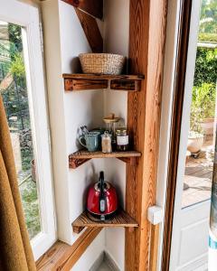 a shelf in a room with a tea kettle on it at Cocon-ardechesauvage in Pont-de-Labeaume