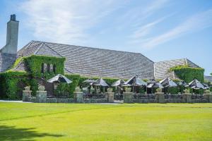a building with a bunch of umbrellas in front of it at Boyne Mountain Resort in Boyne Falls