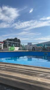 a view of a water park from a train at Casa Collina - Isola in Pisticci