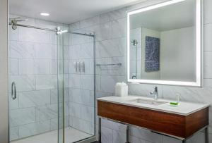 a bathroom with a sink and a shower at Le Meridien Indianapolis in Indianapolis +73 photos