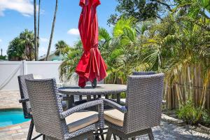 a red umbrella sitting on top of a table at Buffalo Bungalow in Clearwater Beach
