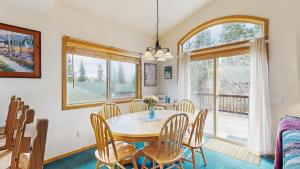 a dining room with a table and chairs at Spring Mountain Condo Pool Gym Slopes in McCall +30 photos