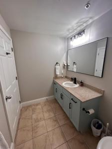 a bathroom with a sink and a mirror at Stunning Gulf View Condo - Direct Beach Access - Stunning Sunsets in Panama City Beach