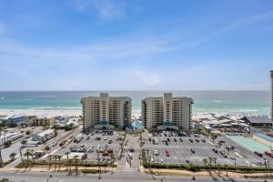 an aerial view of a parking lot in front of the ocean at Stunning Gulf View Condo - Direct Beach Access - Stunning Sunsets in Panama City Beach