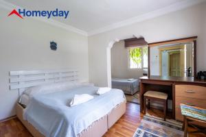a bedroom with a desk and a bed and a desk at Villa Mountain with Pool in Gedeller +38 photos