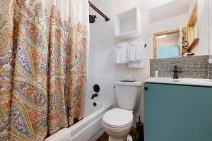 a bathroom with a toilet and a shower curtain at Park Meadows 7D by Ski Country Resorts in Breckenridge +32 photos