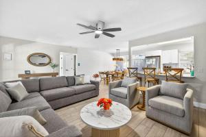 a living room with a couch and chairs and a table at Lantana Cabana in Clearwater Beach +36 photos