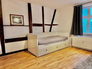 a bedroom with a bed in a room at Apartment Weilburg Lahnblick in Weilburg