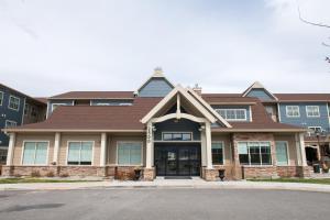 a large house with a brown roof at Residence Inn by Marriott Helena in Helena