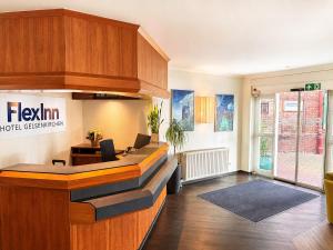 an office with a reception desk in a building at FlexInn Hotel Gelsenkirchen in Gelsenkirchen