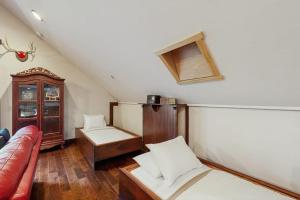 a living room with a couch and a table at Deer Haven Lodge in Kalispell