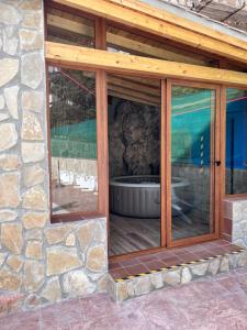 a window on a stone building with a tub in it at Casa Angel in Cazorla
