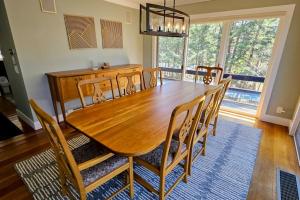 a wooden table and chairs in a dining room at Partridge Hill House in Hartford