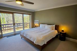 a bedroom with a large bed and a balcony at Partridge Hill House in Hartford +75 photos