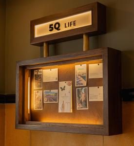 a display case with a sign that says life at 5Q House Quinta Camacho in Bogotá