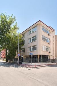 a building on the corner of a street at Kaira Homes 1 in Ankara