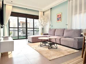 a living room with a couch and a table at comfort homes in Kampala
