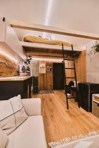 a living room with a bunk bed and a couch at OLA I Oáza Les Atmosféra I Oasis Forest Atmosphere in Petrov