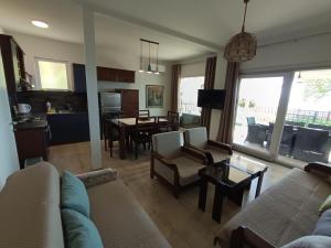 a living room with a couch and a table at Villa Paradiso in Ohrid